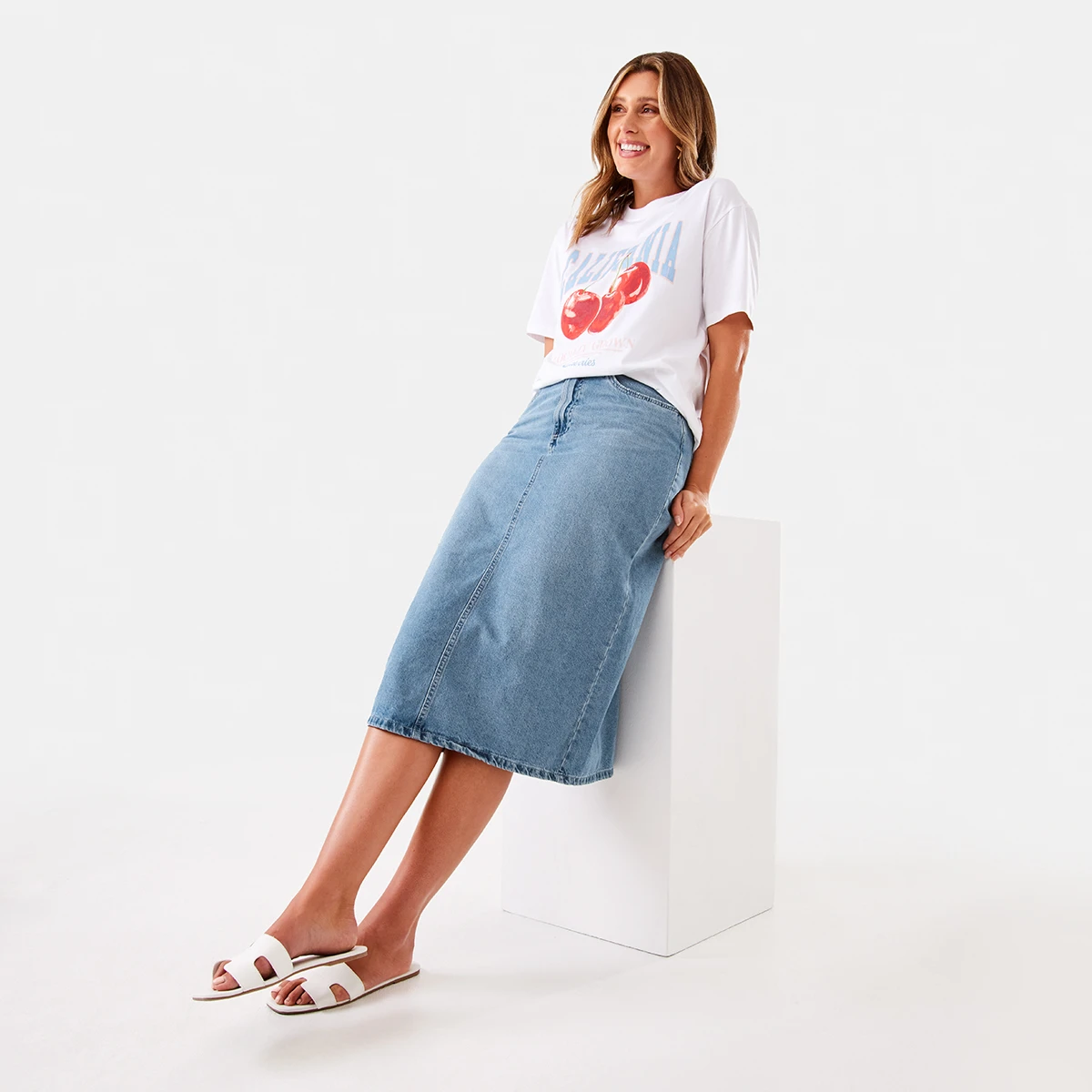 Woman Wearing Denim Midi Skirt and White T-Shirt