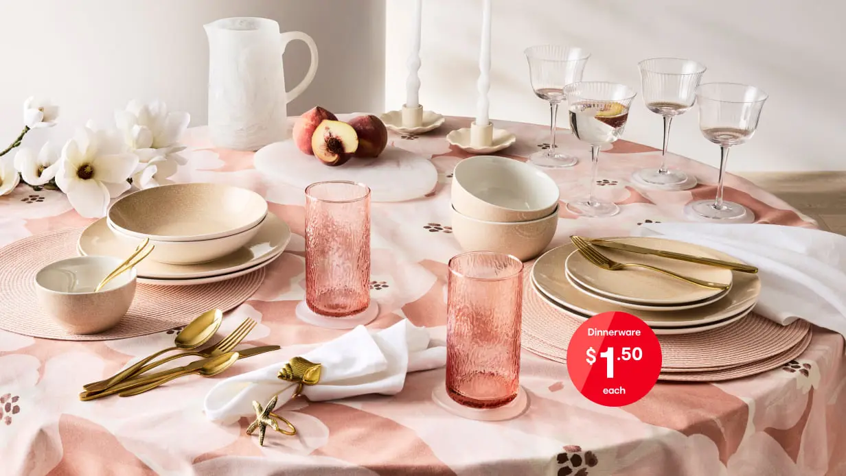 Dining table set up with dinnerware set assortment with price roundel