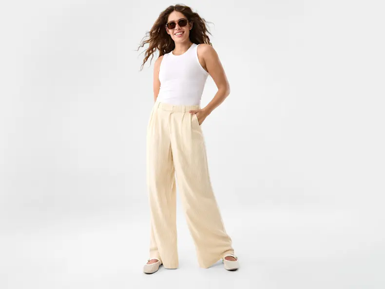 Women wearing retro sunglasses, and summer yellow cargo pants