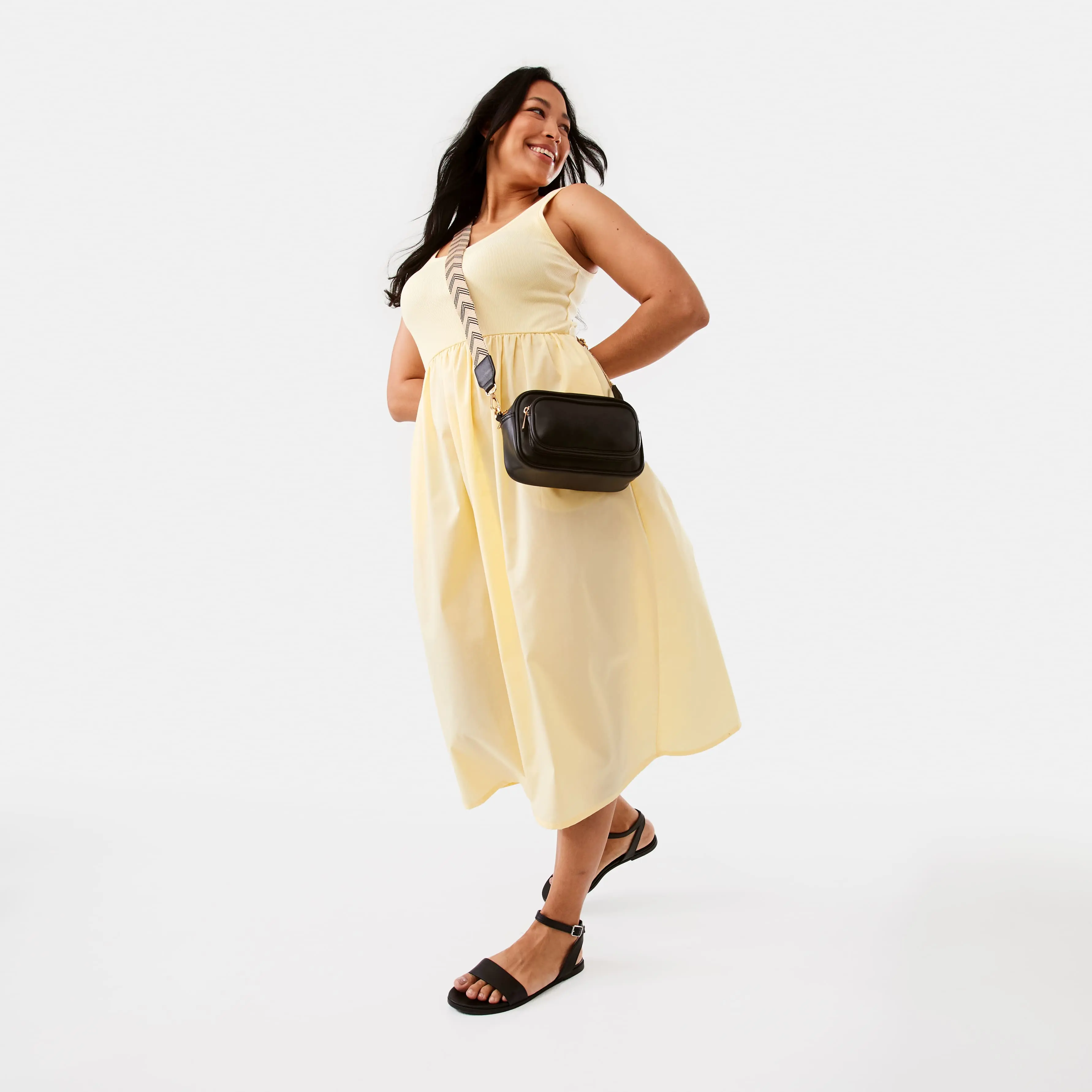 Sleeveless Knit Woven Midi Dress In Yellow Color with a black crossbody bag