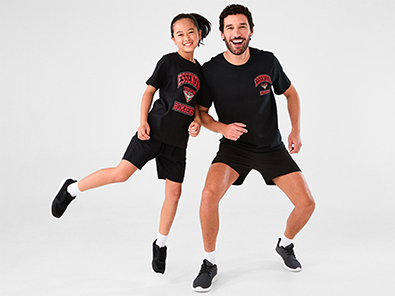 father and daughter duo wearing matching AFL T-sh