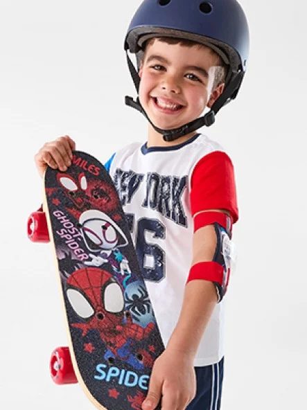 Boy holding Marvel skateb