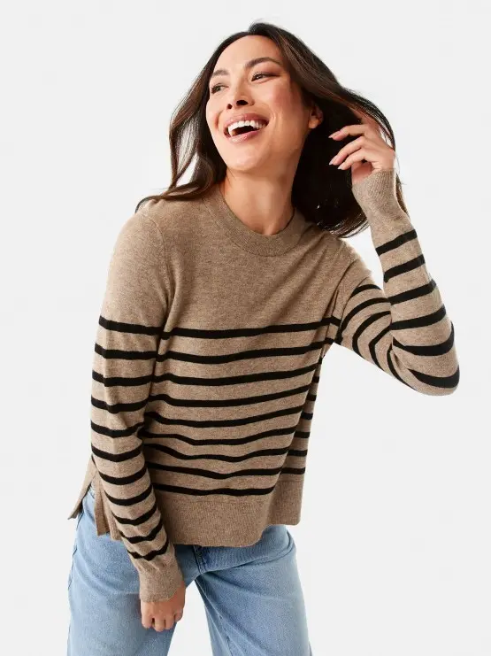 Woman wearing striped brown knit ju