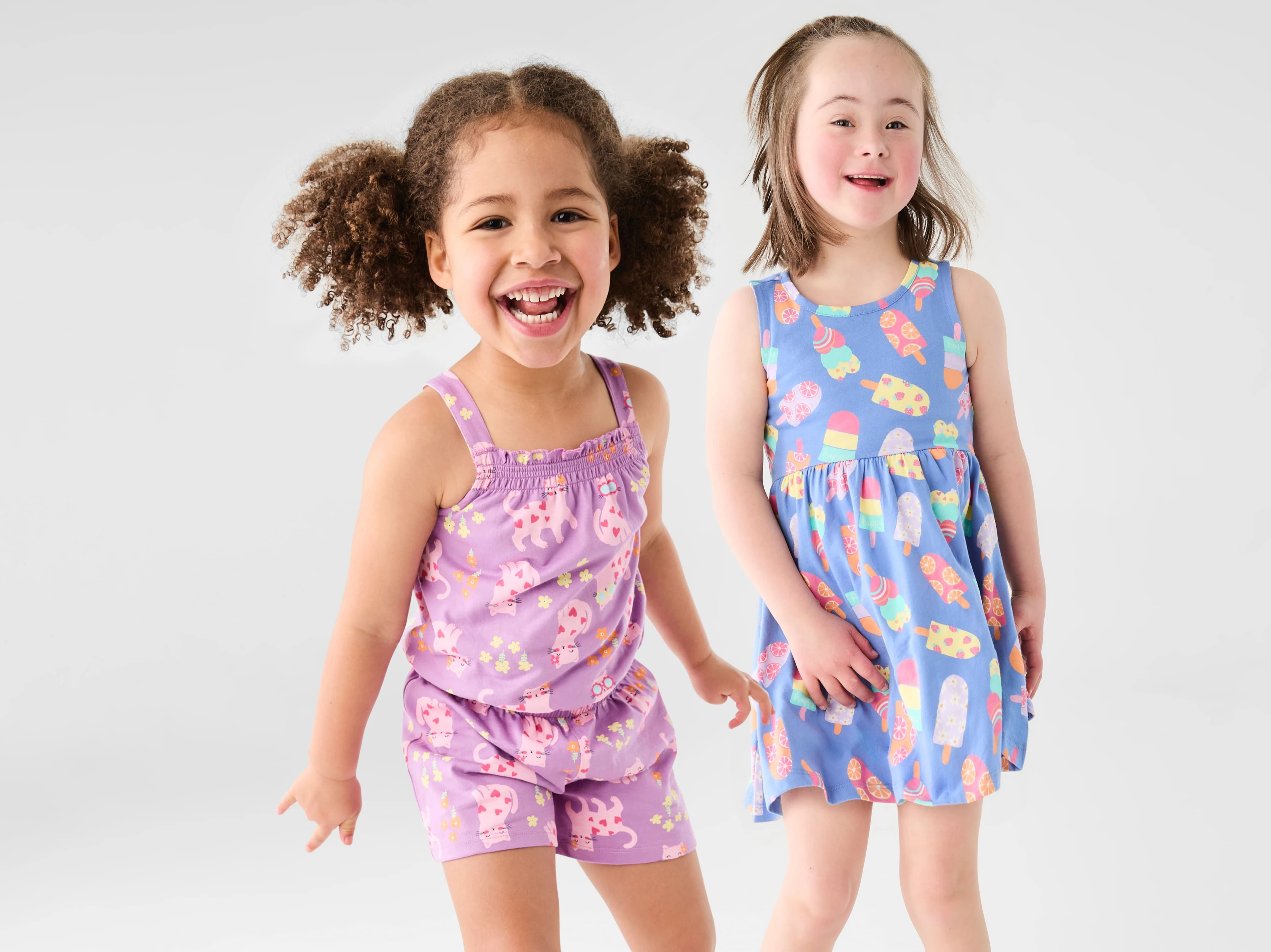 2 Young Girls Wearing Jersey Playsuit and Jersey Icecream Dress