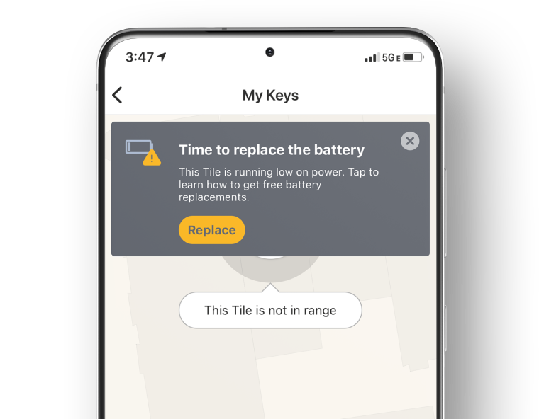 A person receiving a Tile alert on their phone tell them that they need to change the battery on their Tile device