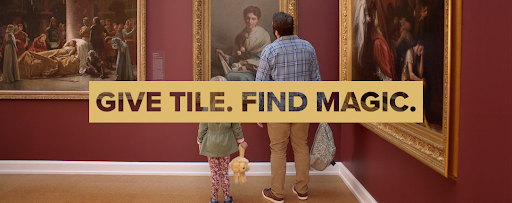 A banner of people at an art museum with the caption "Give Tile. Find Magic"