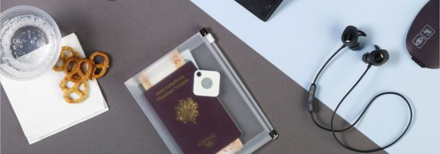 A passport with a Tile mate attached
