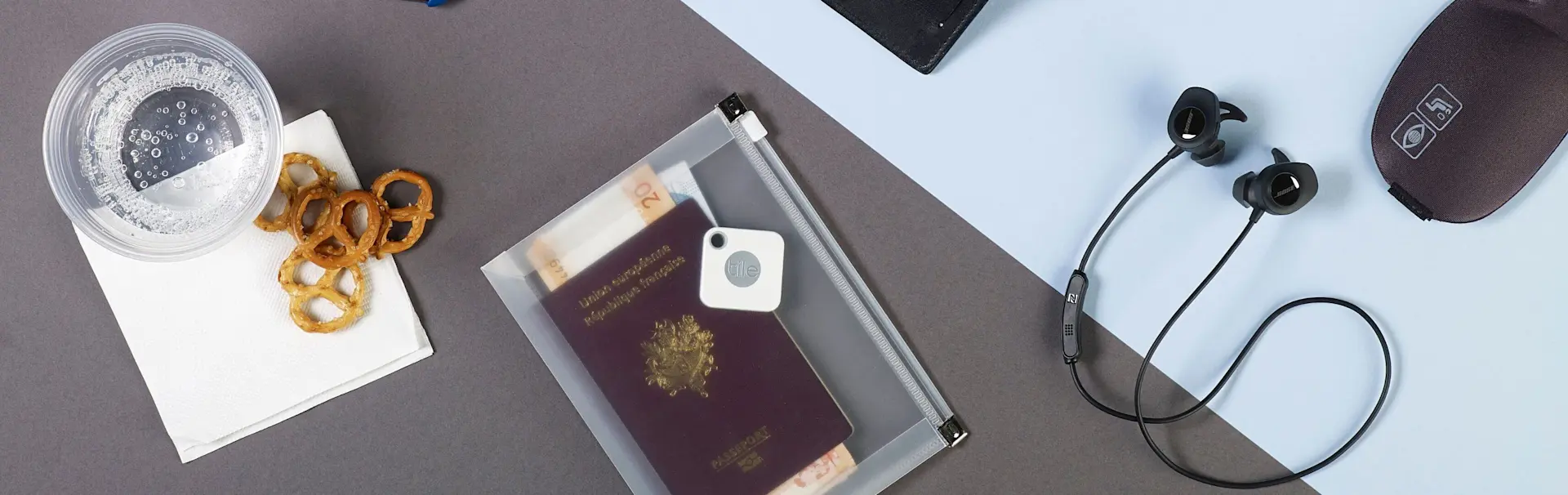 A passport with a Tile mate attached