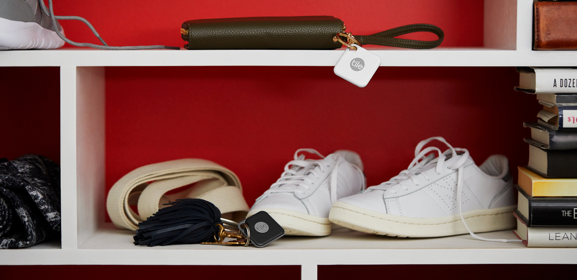 A storage shelf with a wallet with a Tile attached