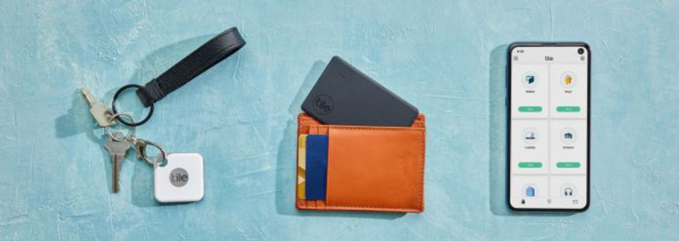 Tile products on keys and in a wallet with the Tile app on a phone