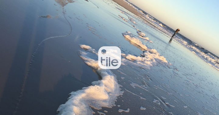An ocean with the Tile logo on it