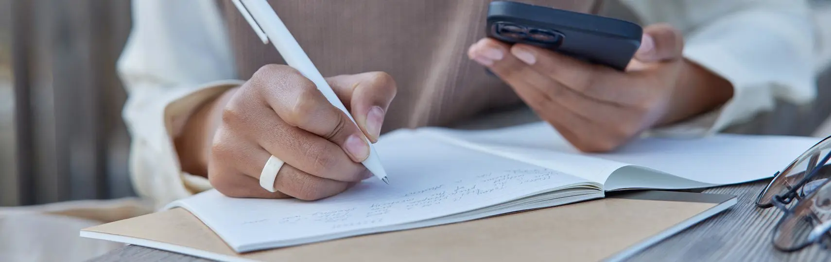 A person writing down their resolutions