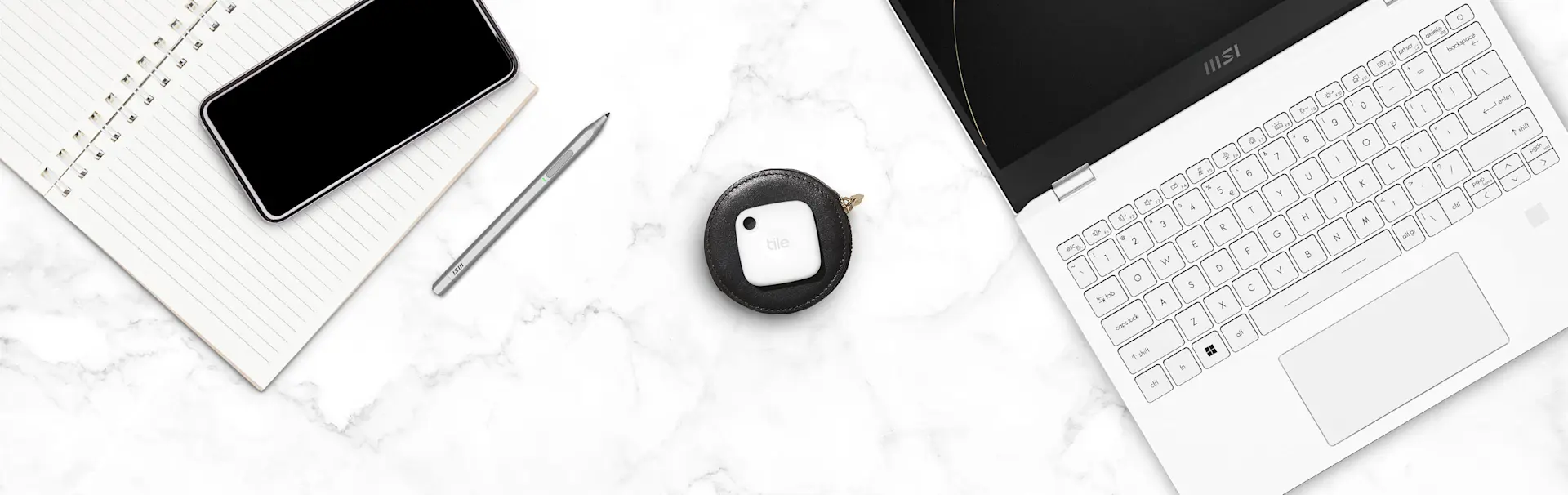 A Tile mate key finder and an MSI laptop