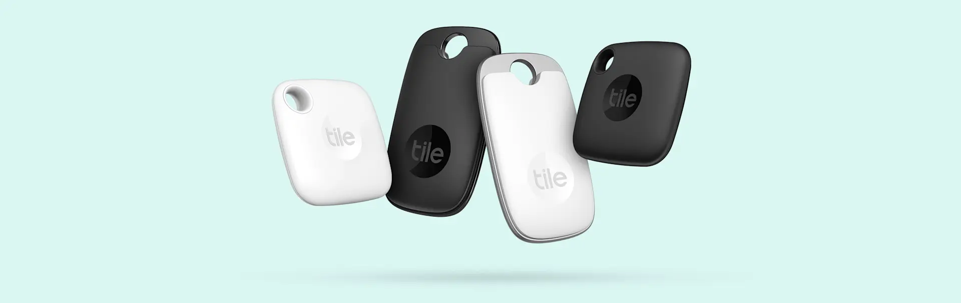 Two pairs of Tile pros and Tile mates in black and white