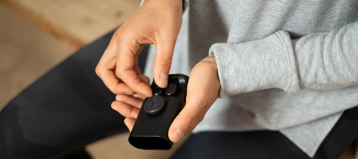 A Tile sticker attached to a device