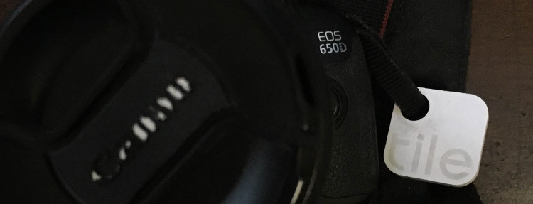 A Tile attached to a camera bag