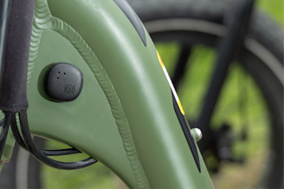 A Life360 Tile Sticker - Black placed on the back seat of a bicycle.