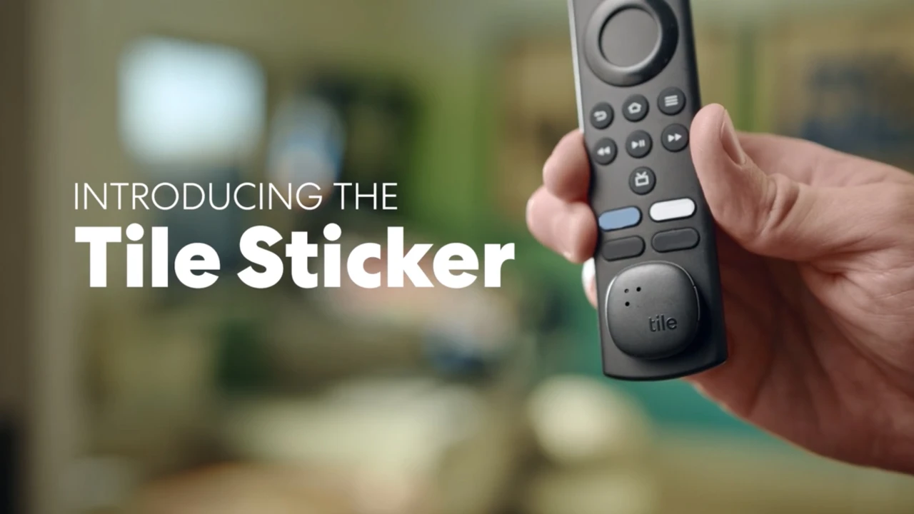 A Black Tile 2022 Sticker is attached to television remote. 
