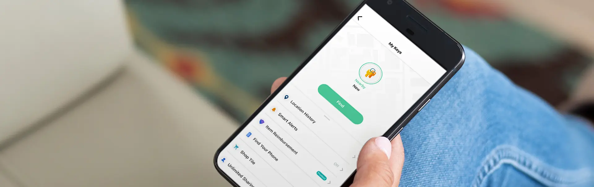 A person with the Tile app open on their phone
