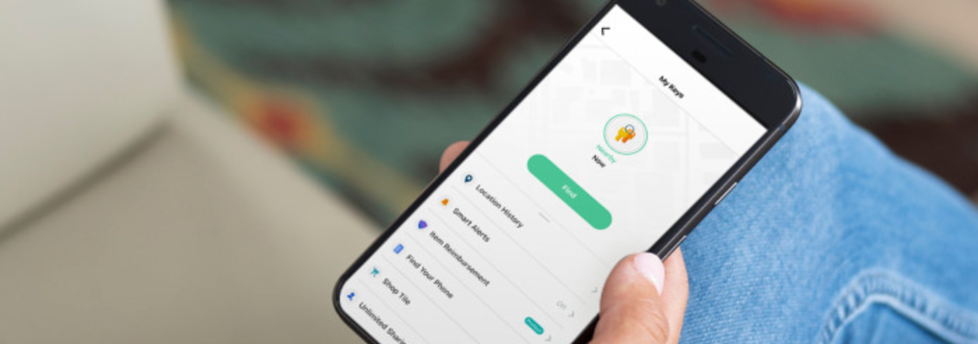 A person with the Tile app open on their phone
