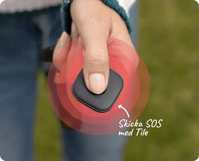 A person pressing the Life360 logo located in the center to alert a silent SOS to those in your family.