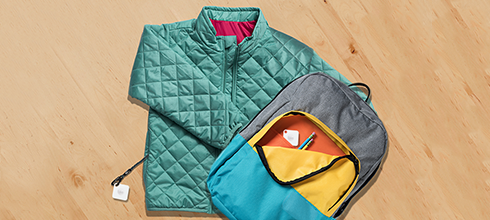 A kid's jacket and backpack with Tiles attached