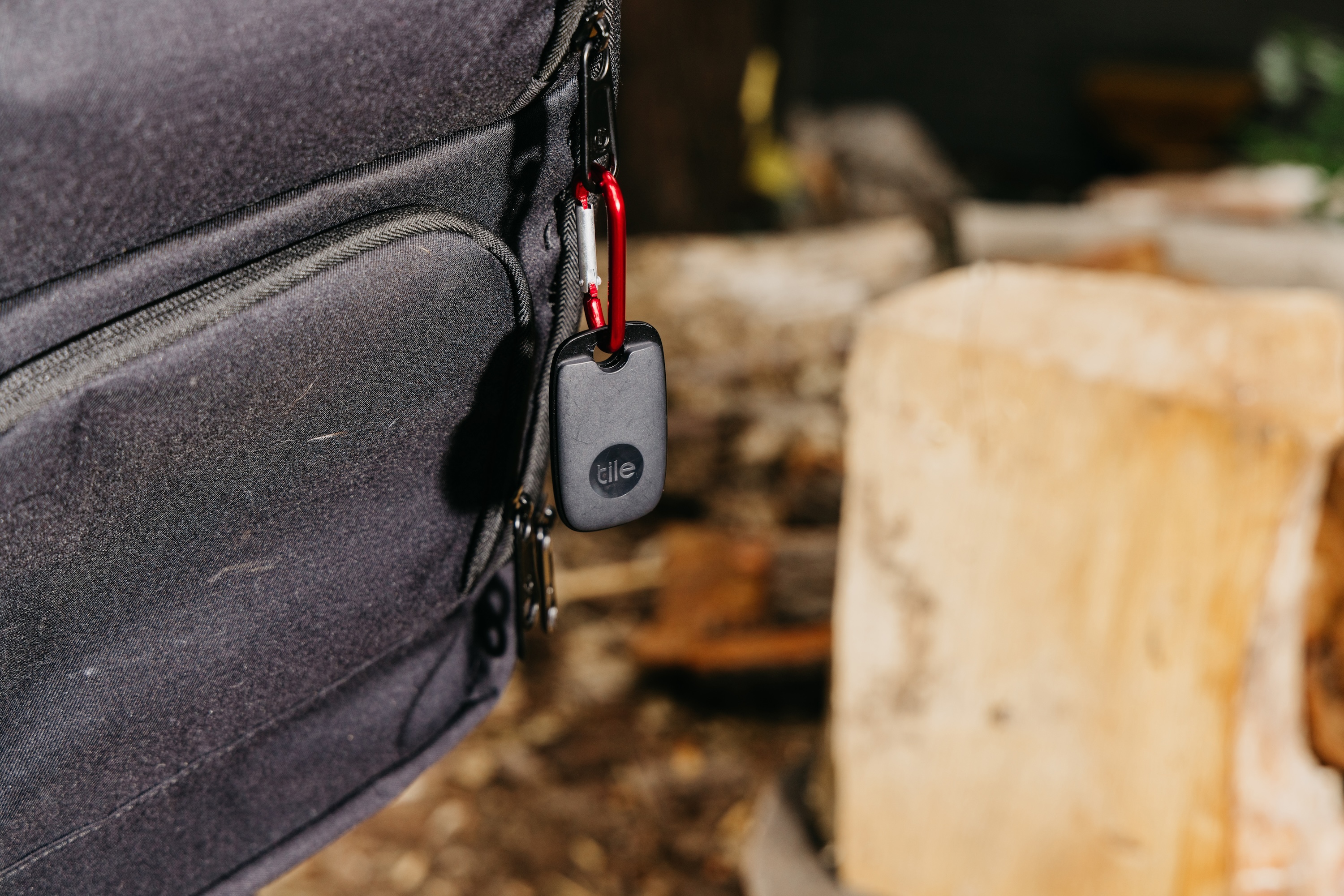 Tile Pro attached to a backpack outside
