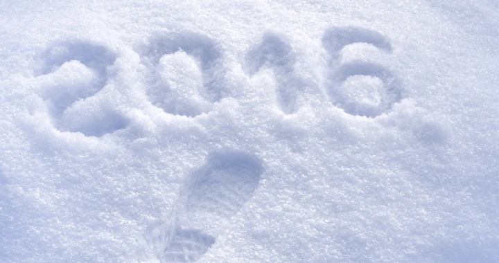 Snow with a footprint and "2016" in it