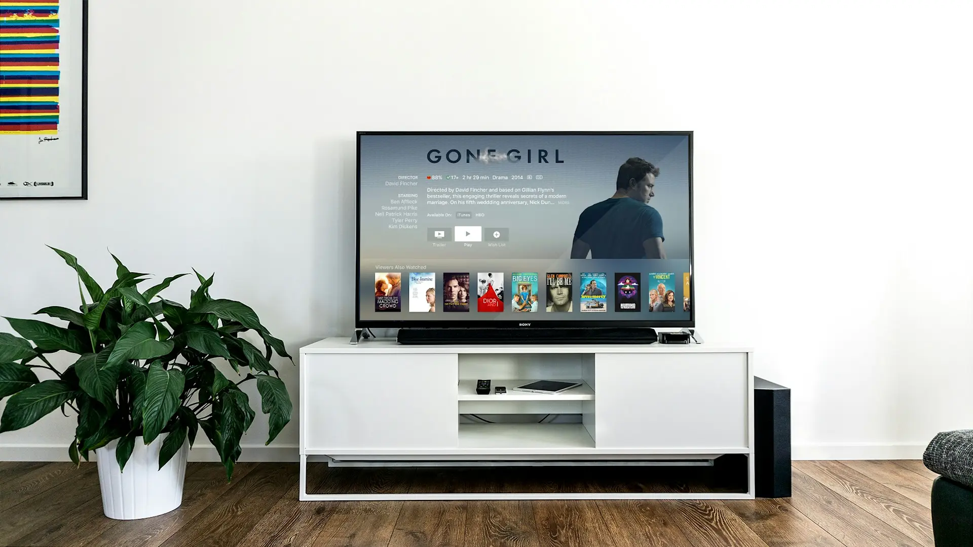 A TV in a living room with Gone Girl on the screen