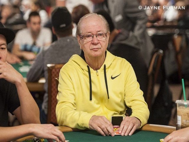 Billy Baxter playing poker with a yellow hoodie