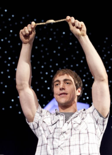Jason DeWitt holding his WSOP gold bracelet