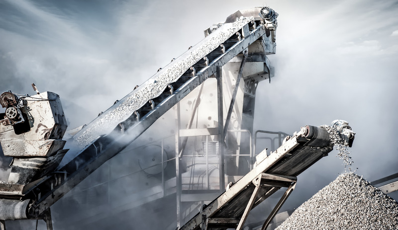 Cement_production_factory_on_mining_quarry._Conveyor_belt_of_heavy_machinery_loads_stones_and_gravel