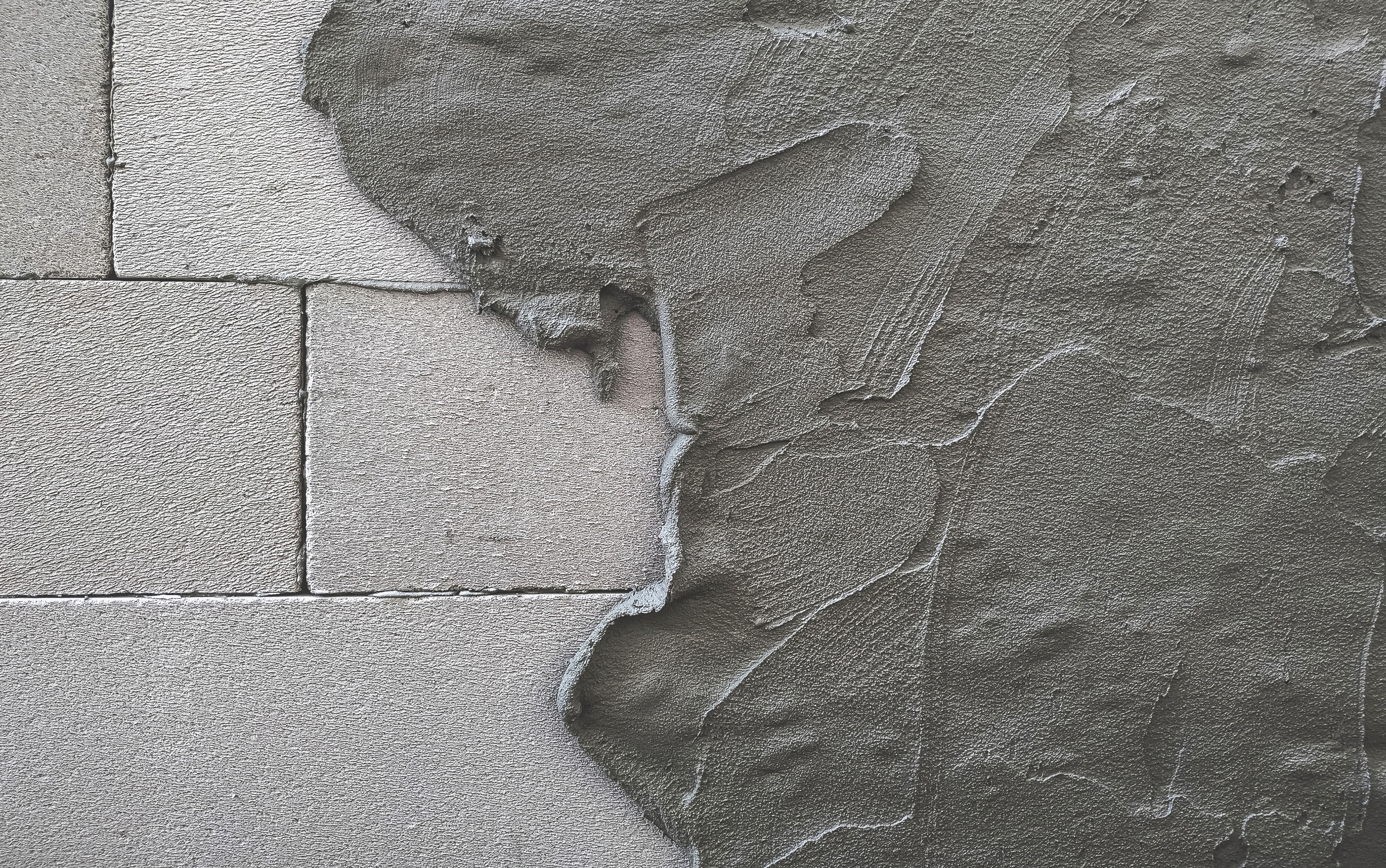 Cement_mortar_mixed_to_bond_building_blocks_and_coating_lightweight_concrete_wall_surface._Plaster_texture_layer._Building_construction