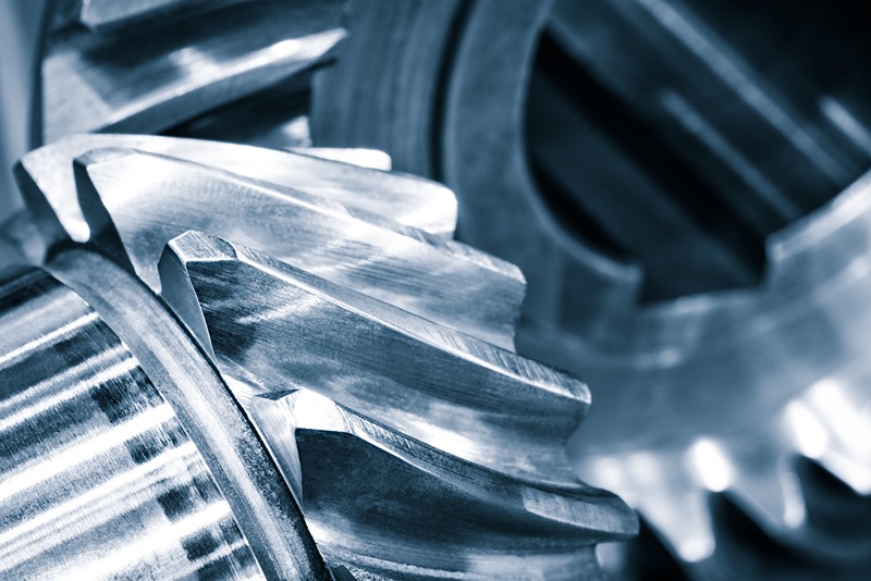 Gears_of_transmission_gearbox,_industrial_background