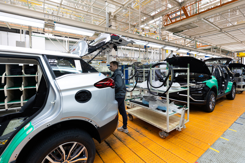 Minsk_belarus_dec_15_2021_car_bodies_are_on_assembly_line_factory_for_production_of_cars_modern_automotive_industry_electric_car_factory_conveyor