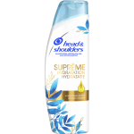 Witte shampoofles met blauwe bladeren en goudkleurige druppel. Argan- en kokosolie.
