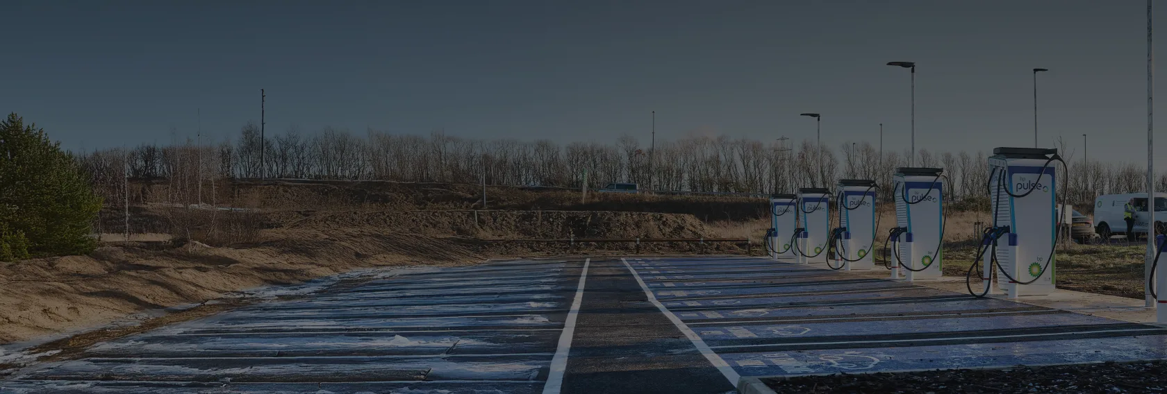 An empty fleet charging station with multiple bp pulse chargers ready to use.