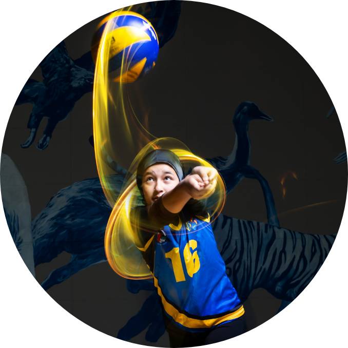 A girl is flicking a volleyball 