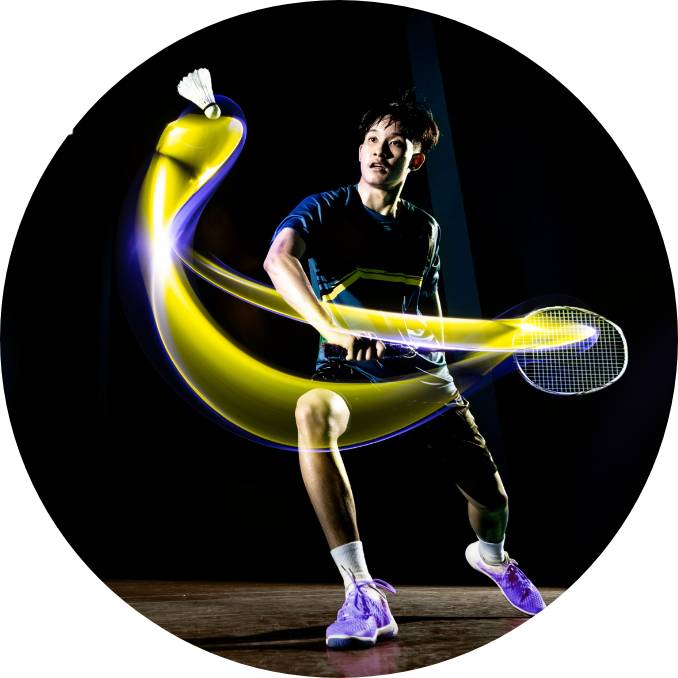 A sports man hitting a badminton stroke
