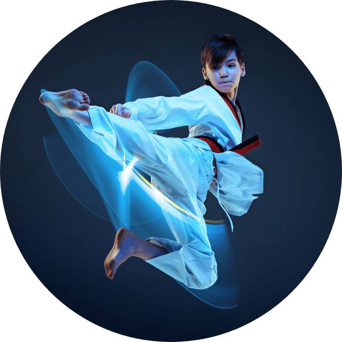 A kid up higher in the air showing his kicking skill while performing martial art