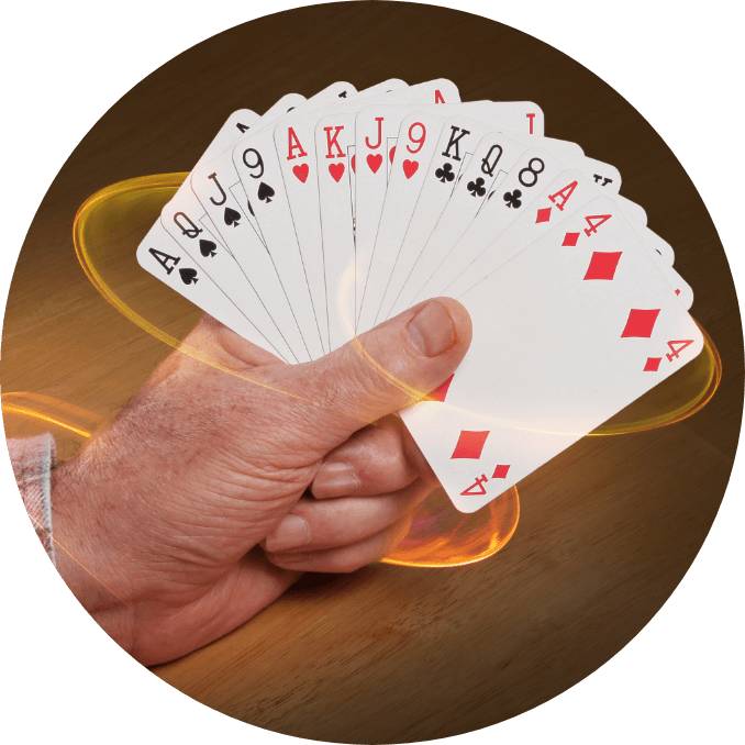 A man is playing with his cards in a club