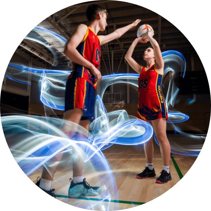 Two young boys playing a netball