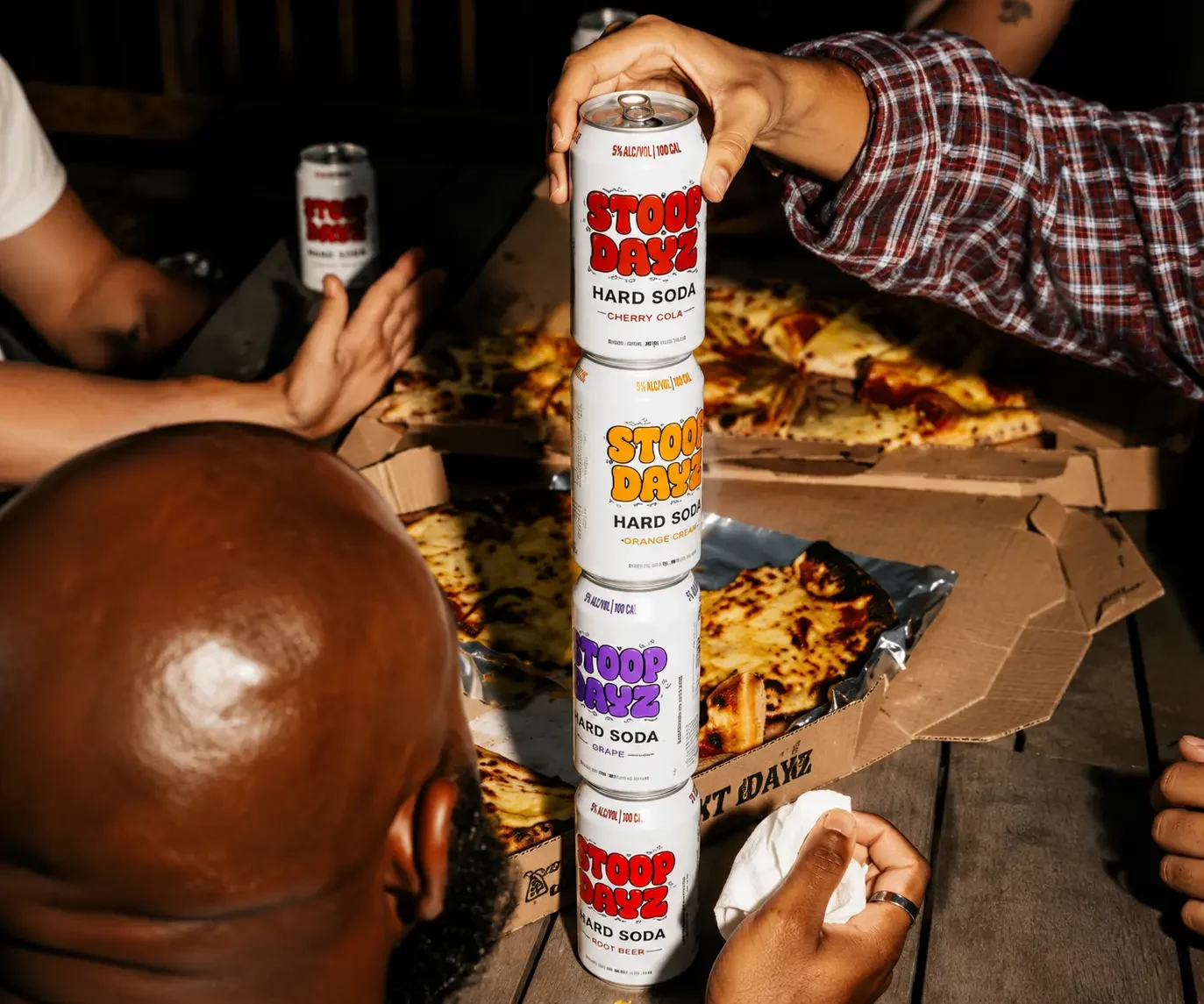 A stack of Stoop Dayz Hard Soda cans