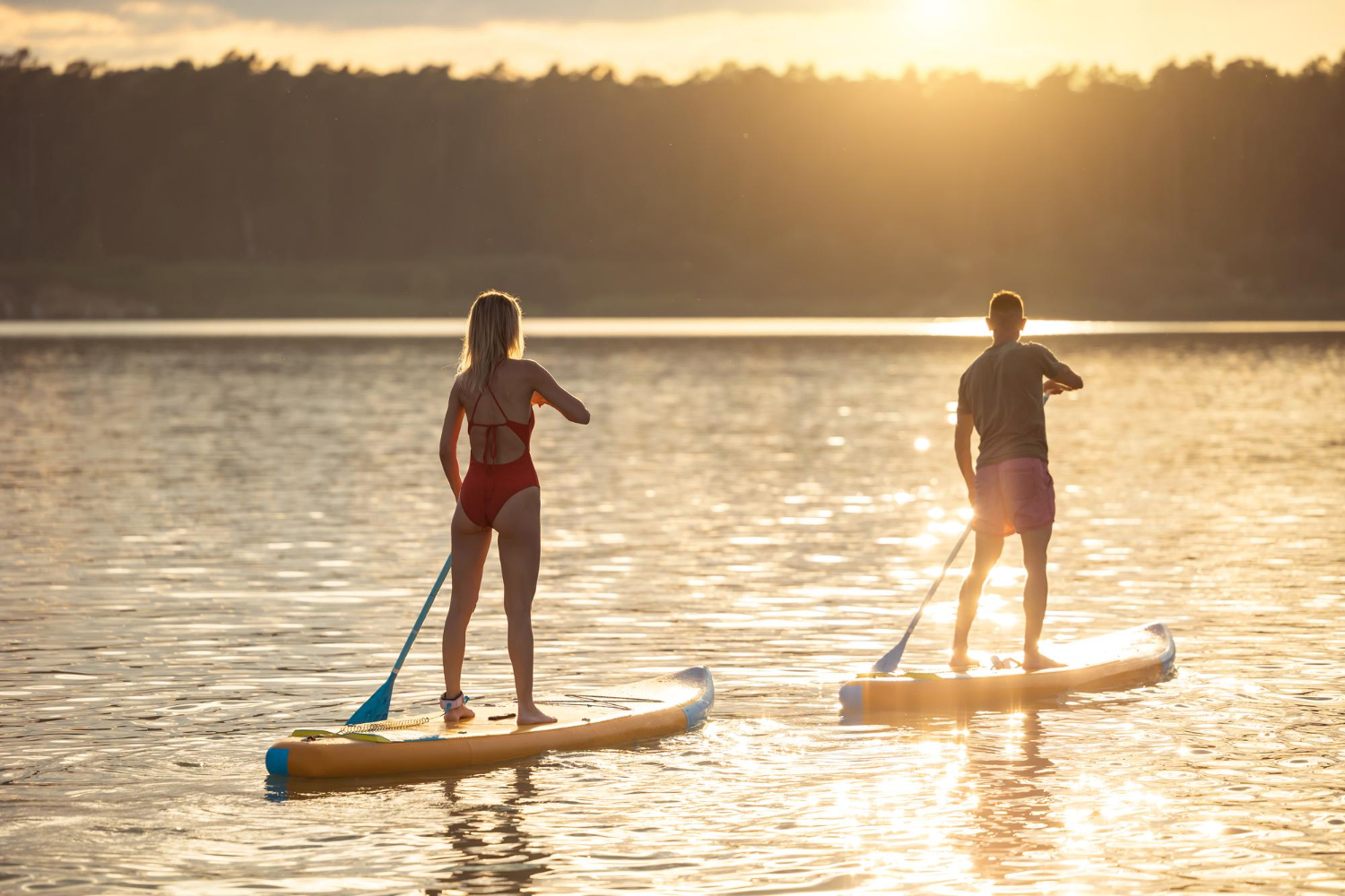 couple paddleboarding