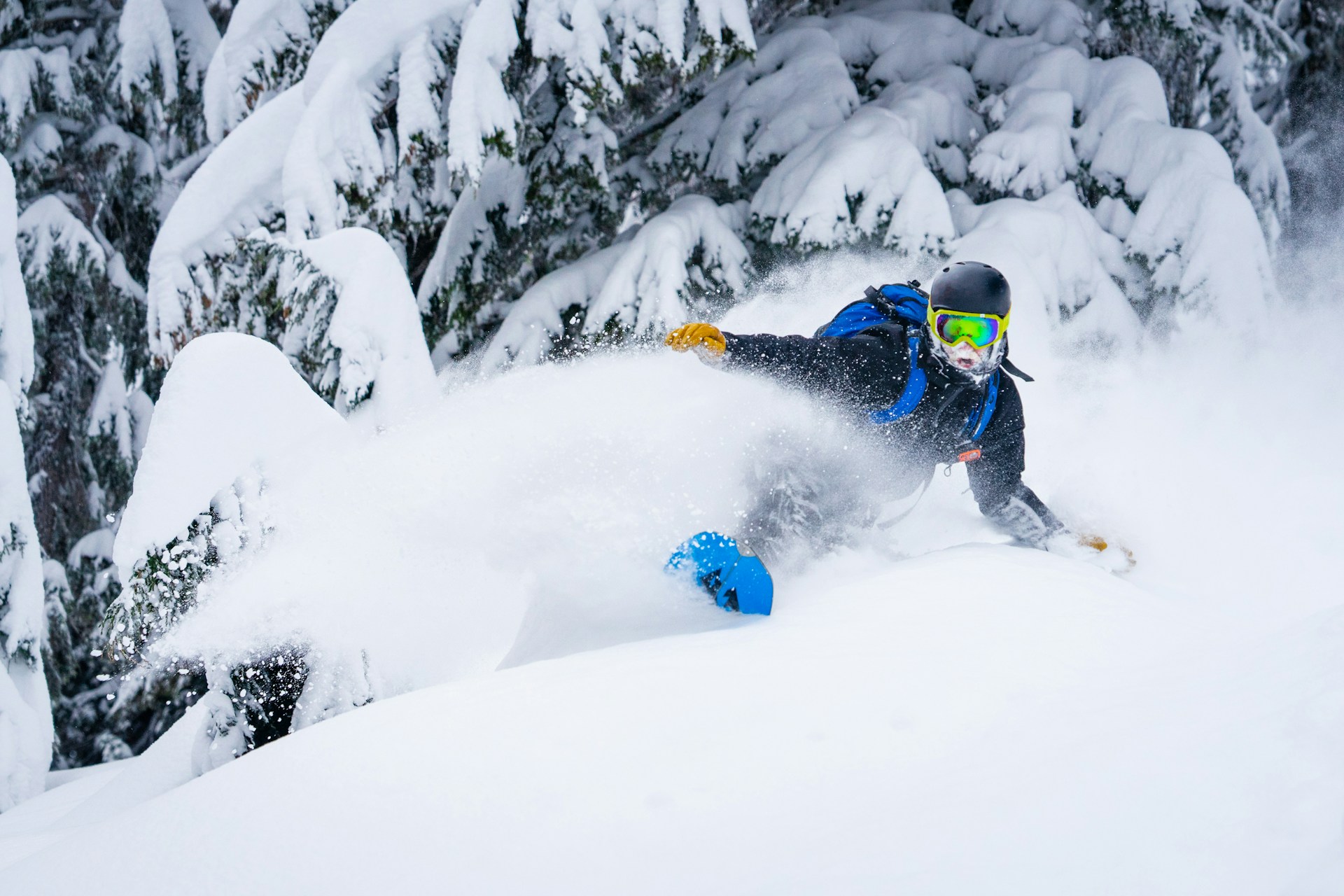 snowboarding-in-powder | A man snowboarding in powder.