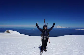 Adam Wise at the top of a mountain.