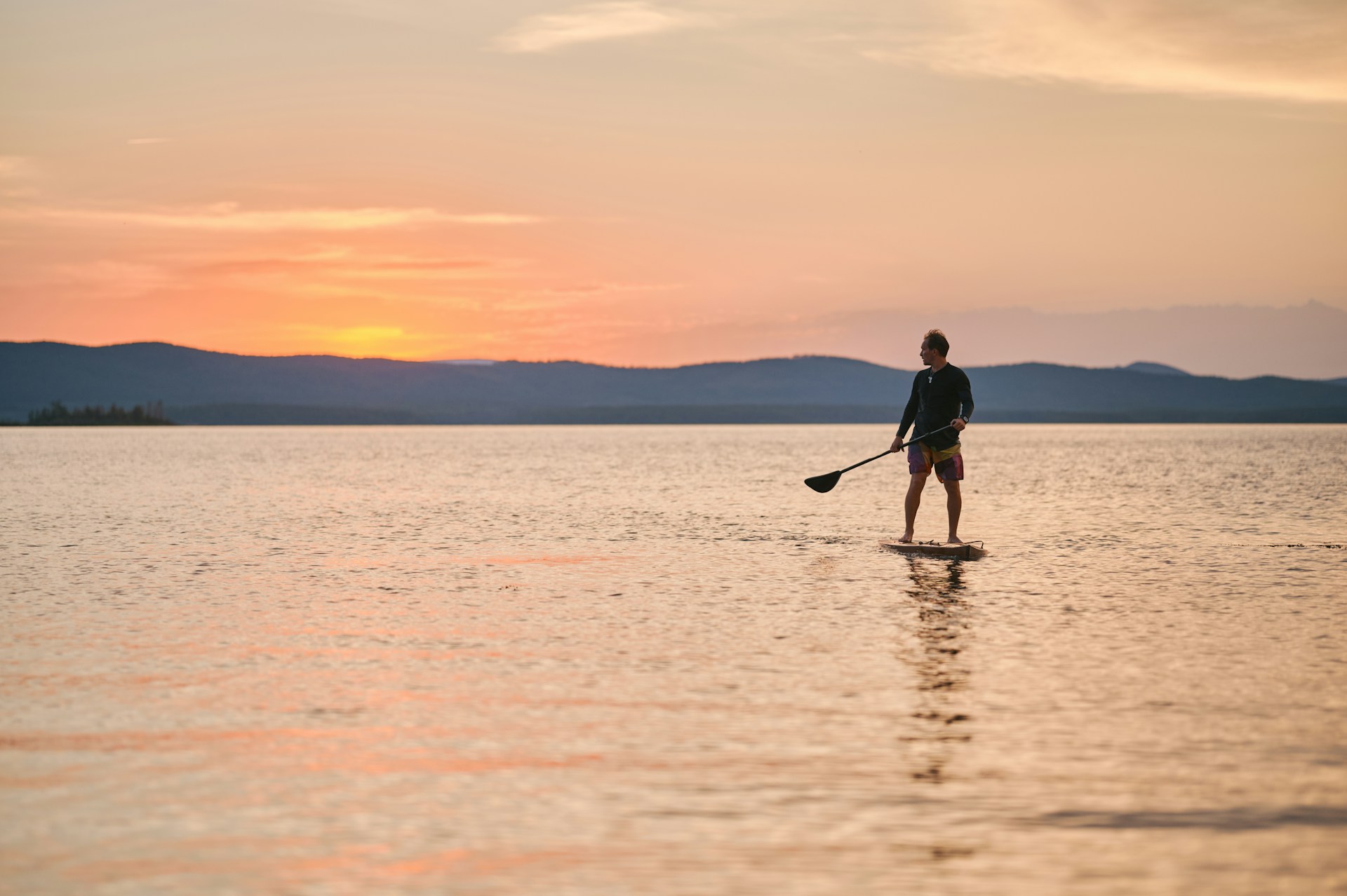 man paddleboarding