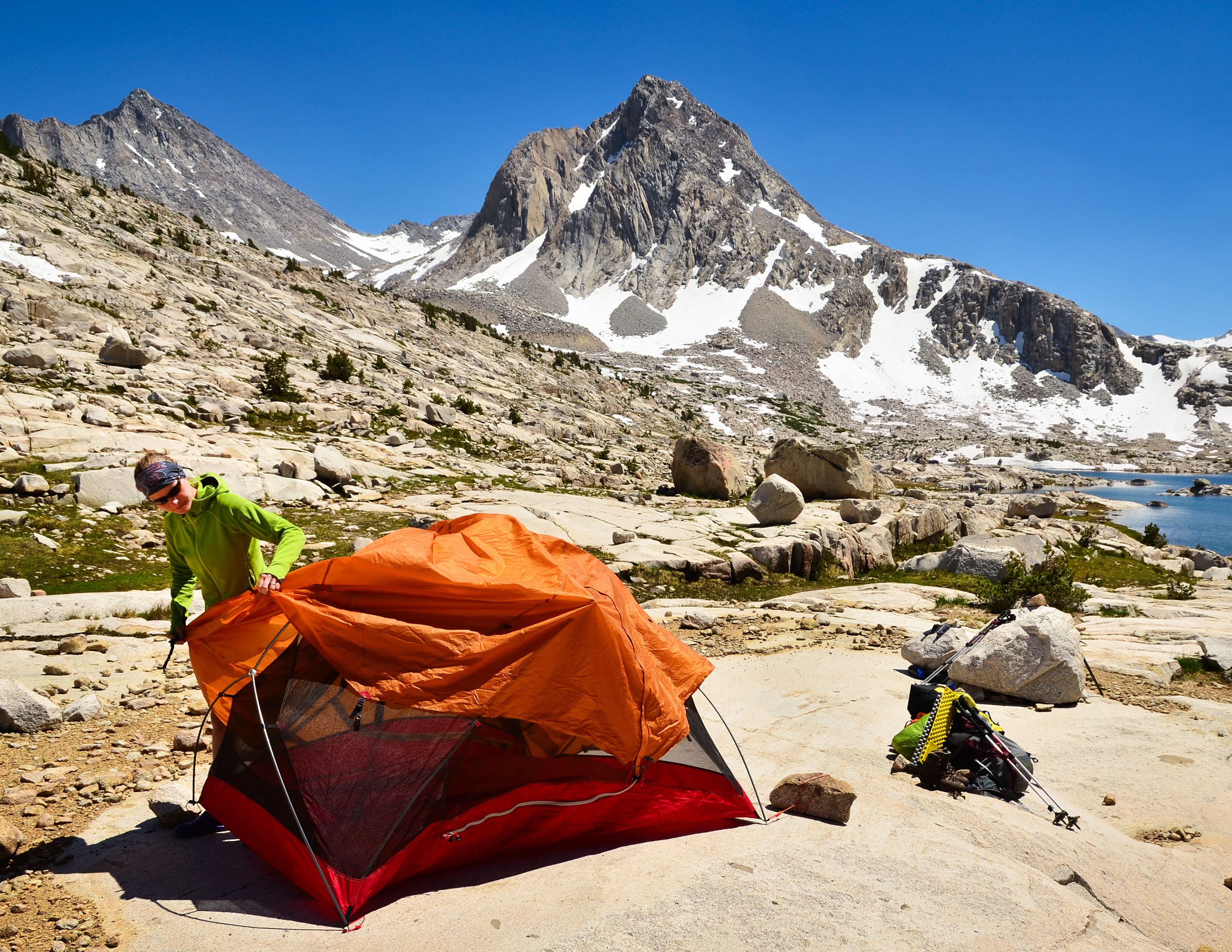 Backpacker setting up camp