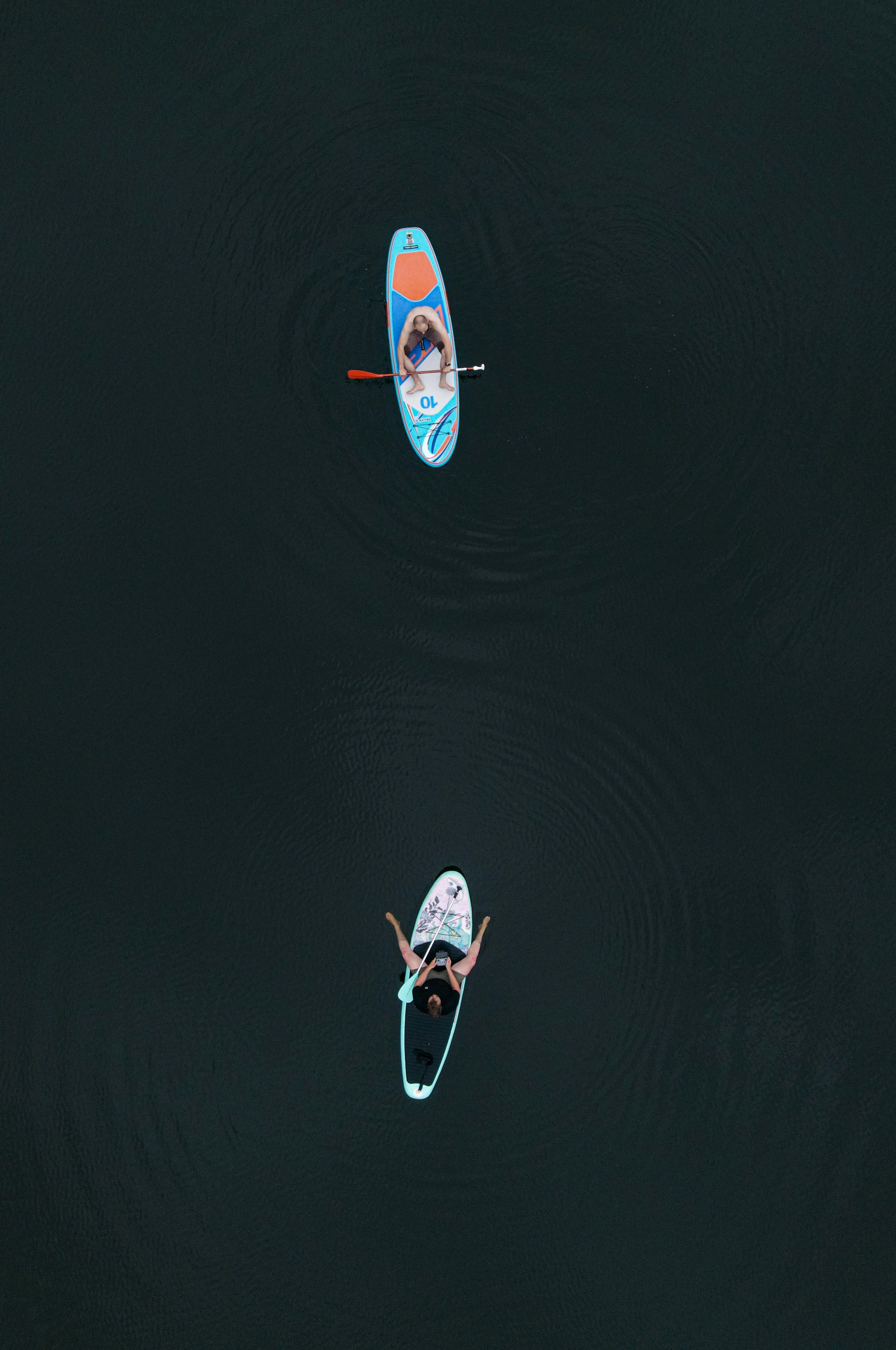 men paddleboarding