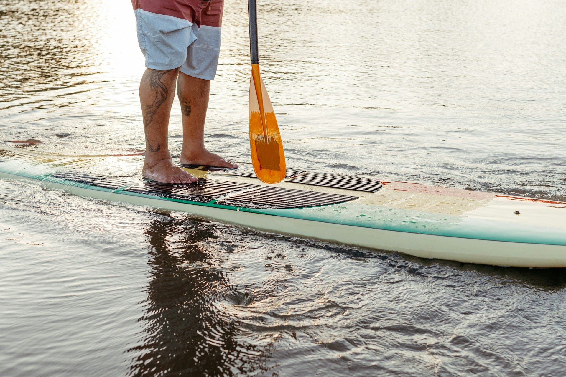 man paddleboarding | man paddleboarding